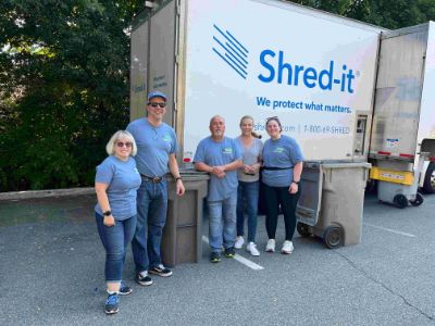 WSB employees posing for picture in front of Shred it Truck